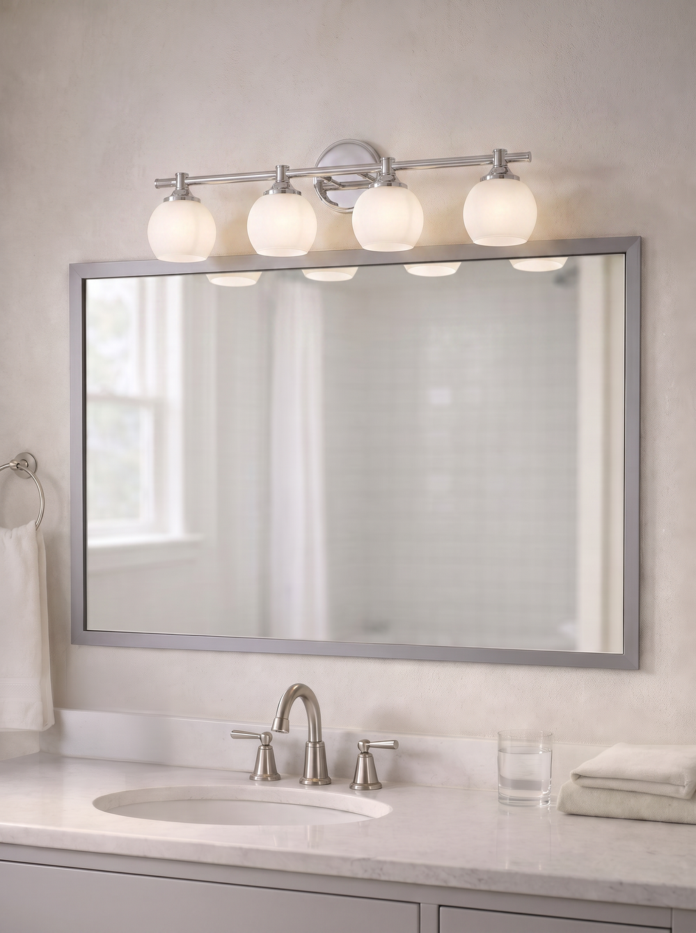 Bathroom mirror updated with a made-to-order frame installed over the existing mirror
