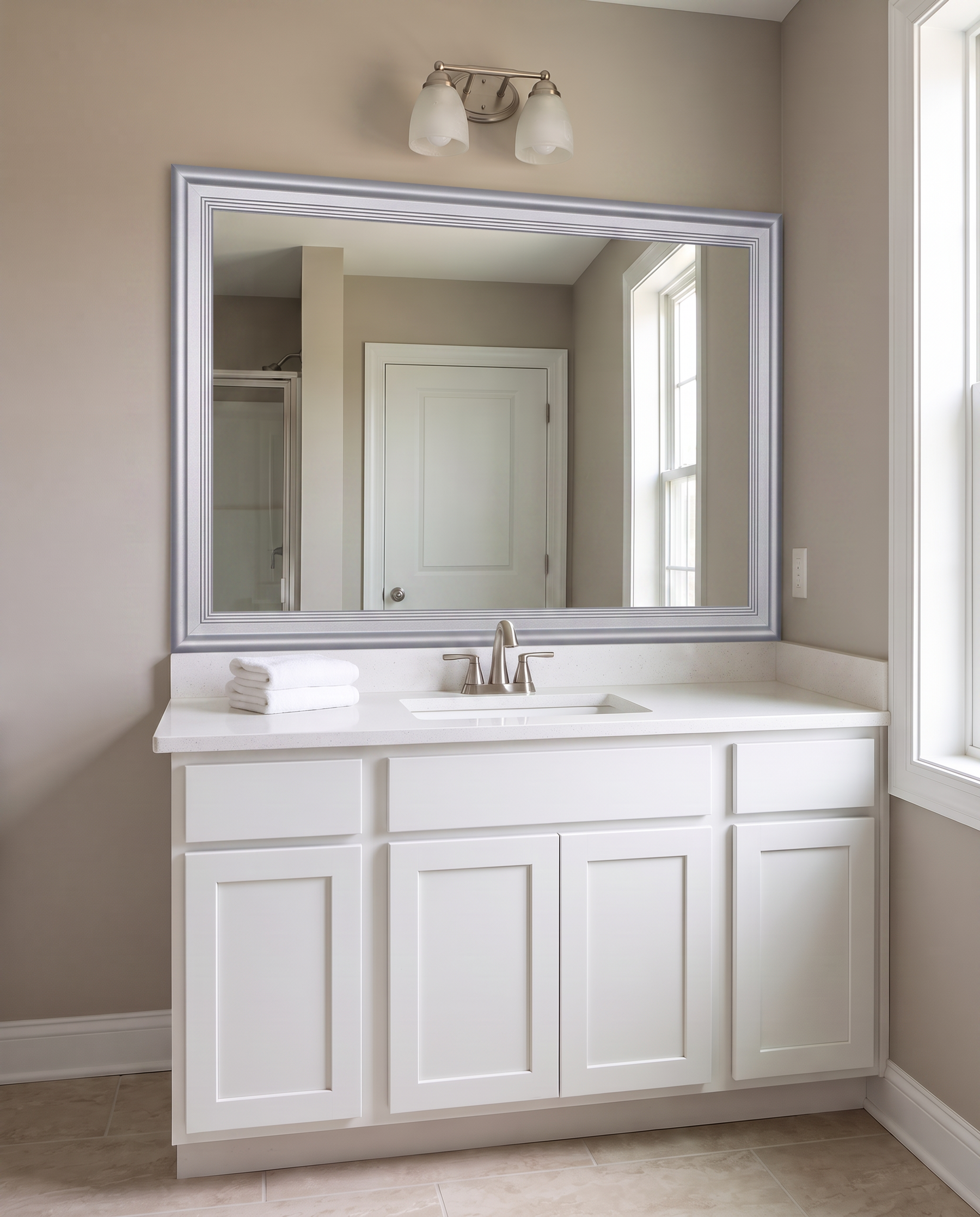 Carson Chrome Reverse mirror frame in apartment bathroom