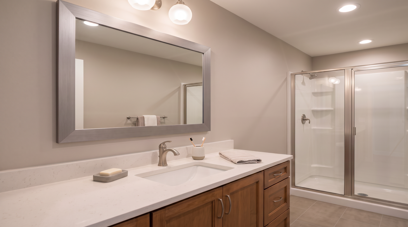 Meade Satin Nickel mirror frame in apartment bathroom