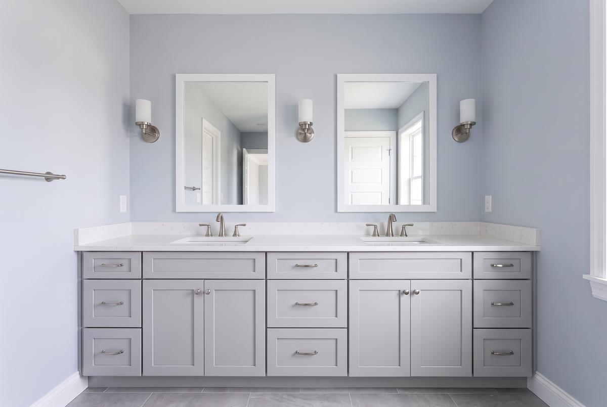 New-construction bathroom with a professionally installed complete framed mirror
