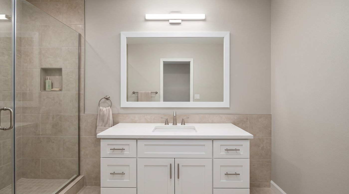 New complete framed mirror installed during a professional bathroom renovation